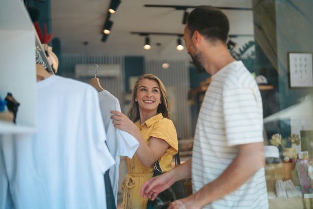 istock T-Shirt Shopping: A Couple's Fun Selection at the Souvenir Shop 2178678985