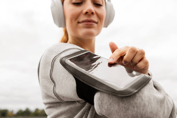 istock Sporty Woman Runner Using Smartphone Outdoors 2178681795