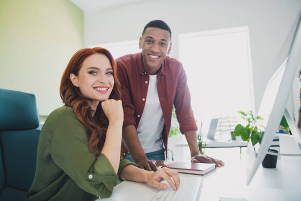 istock Portrait of two young successful colleagues computer desktop workplace business center office indoors 2178682644