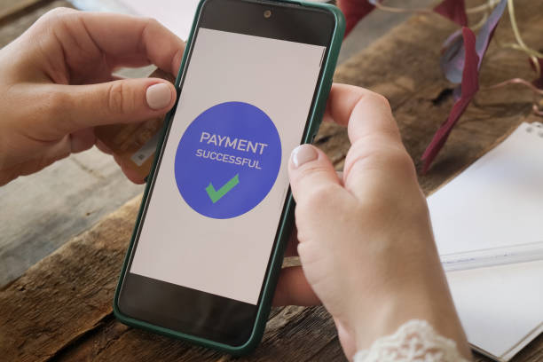 istock Hands make money transfer using smartphone and plastic bank card 2178683474