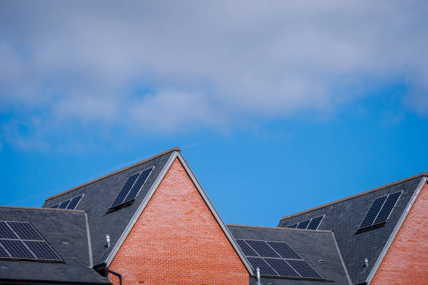 istock Solar energy panel on new built house roof in england uk 2178683781