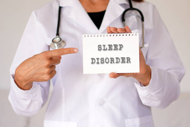 istock Sleep disorder concept. woman doctor pointing to words in a notebook 2178683857