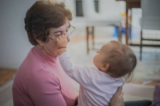 istock Baby takes grandma's glasses 2178684585