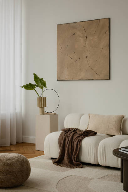 istock Simple and minimalist composition of living room with white sofa, wooden coffee table, cube with accessories, personal stuff, and beautiful decorations. Home decor. Template. 2178684618