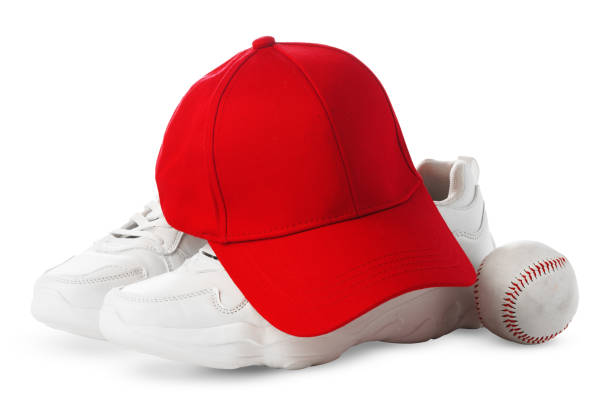 istock Red Baseball Cap, White Sneakers, and Ball on a white Background 2178684670