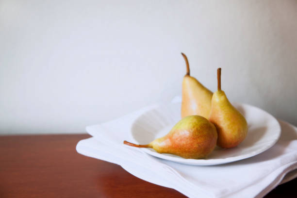 Italy, Tuscany, Siena , plate of pears on display.
