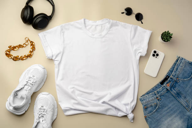 istock White T-shirt, jeans and sneakers on beige background 2178687003