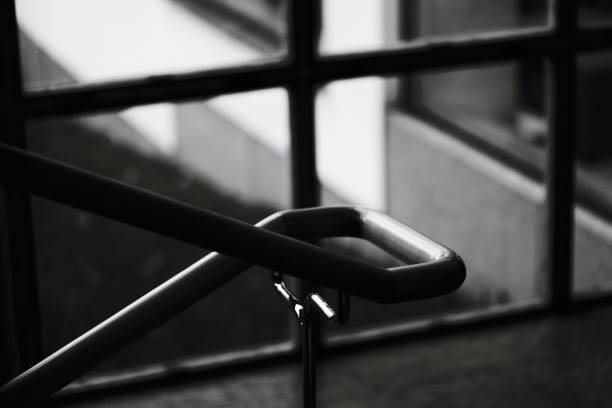 A classic railing in black and white photograph.