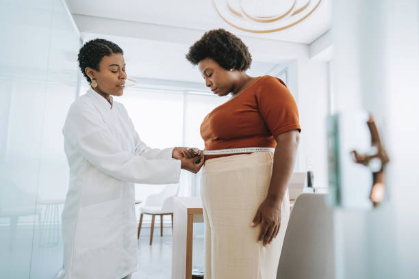 istock Measuring belly with tape measure 2178689100