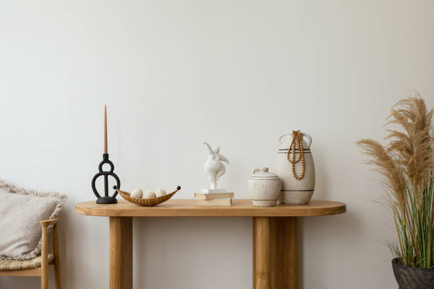 A tastefully curated tabletop decor with a touch of rustic charm, featuring ceramic vases and minimalist ornaments. Copy space.