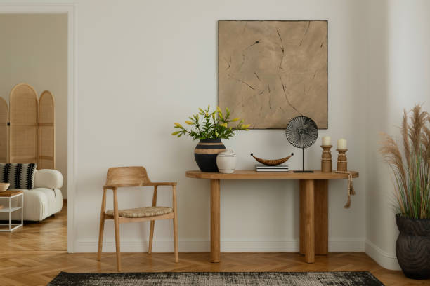 istock An elegant interior setup with a wooden chair, console table, and chic decor. The room exudes warmth and style, blending natural materials with contemporary design elements. 2178689996