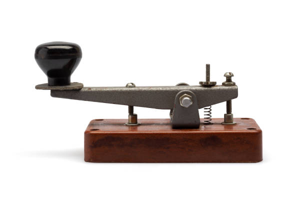 istock Telegraph key or Morse key isolated on white background. Vintage Morse code telegraphy device side view. 2178690492