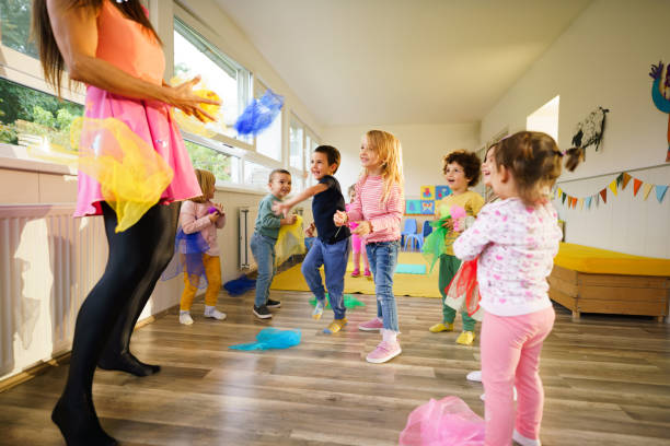istock Children have fun with the animator in the playroom 2178691702