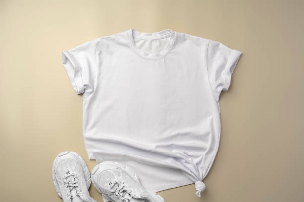 istock White T-shirt and sneakers on beige background top view 2178691715