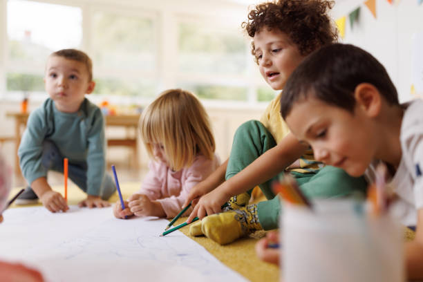 istock Children drawing with crayons in kindergarten 2178692633