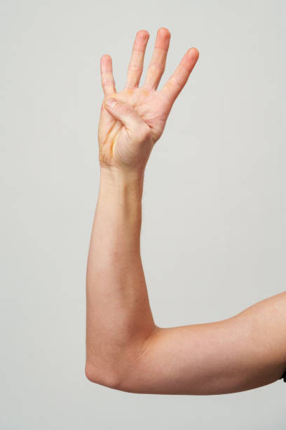 istock Male hand showing four fingers on gray background 2178694418