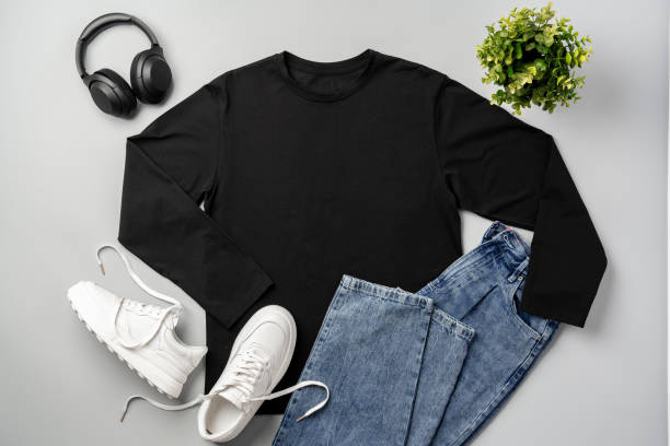 istock T-shirt, jeans and white sneakers on gray background top view 2178694709