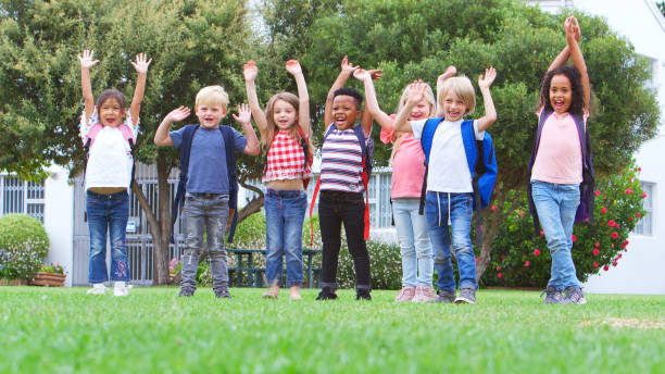 istock Excited Elementary School Pupils On Playing Field At Break Or Going Home Time 2178695135