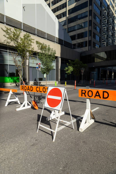 istock Urban roadway blocked by barriers indicating 