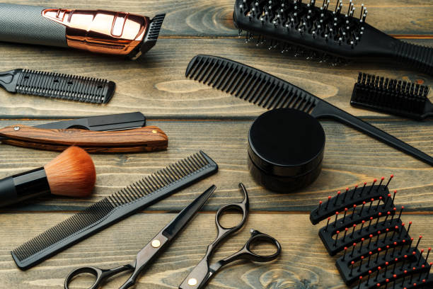 istock Set of professional barber tools on wooden table 2178697387