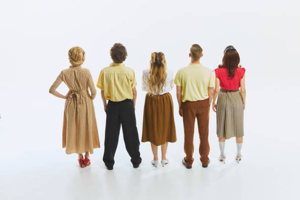 istock Group of five individuals stand i line, their backs facing the camera, creating sense of anticipation as they observe something together. 2178699004