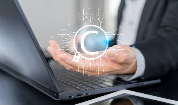 istock Businessman with copyright technology symbol on virtual screen for author rights and patent intellectual property 2178699223