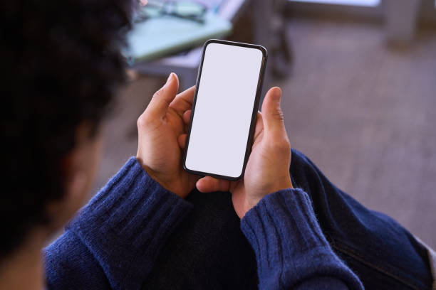 istock Man holding smartphone with blank screen indoors 2178702816