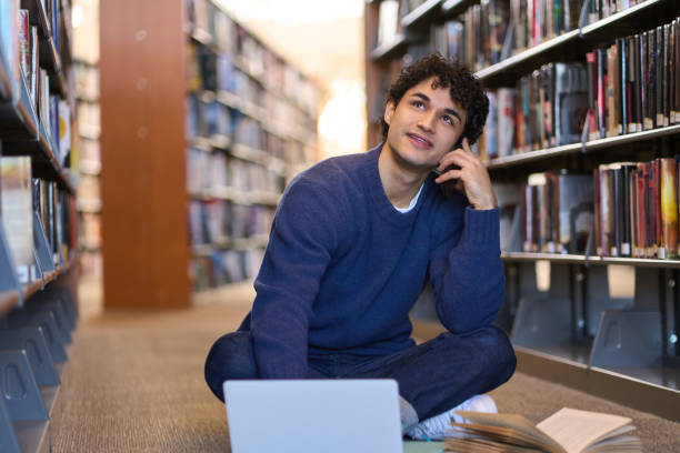 istock Thoughtful student researching and brainstorming in university library 2178702897
