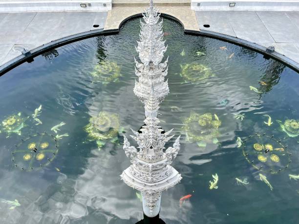 Thailand - Chiang Rai - White Temple or Wat Rong Khun  It is of the most beautiful temples built in this century. A masterpiece famed for his extravagant and unique Buddhism-related paintings, Wat Rong Khun reflects the artist’s grand visions of heaven, hell and Nirvana.