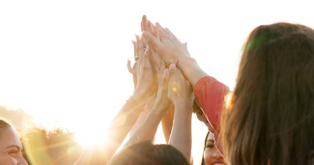 istock High five, support and hands with people in city for motivation, teamwork and community. Future, success and partnership with group of friends in outdoor for youth, celebration and solidarity 2178704367