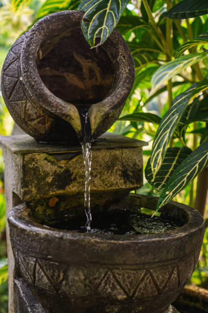 istock Stone Water Fountain with Flowing Stream in Garden 2178705653