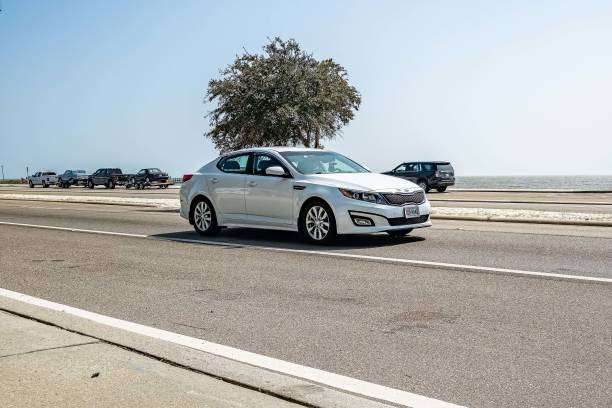Gulfport, MS - October 04, 2023: Wide angle  front corner view of a 2015 Kia Optima LX 4 Door Sedan at a local car show.
