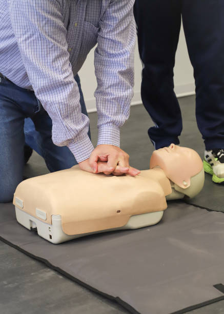 istock first aid course - company safety - cardiac massage - Basic Life Support 2178713616