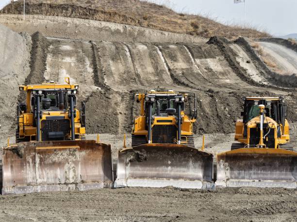istock Yellow dozer parade of different sizes 2178713937