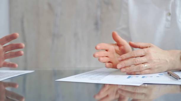 istock Unrecognizable business people clapping over glass table after contract signing in office. Agreement and handshake themes 2178714730