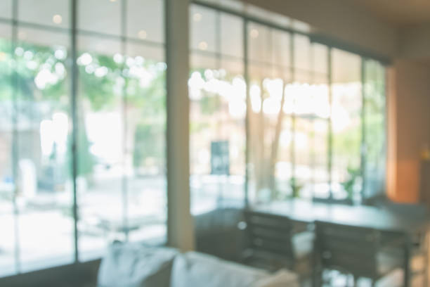 istock Abstract blur interior coffee shop or cafe for background. Blur restaurant interior banner. Hospital and clinic blurry with bokeh. Blurred windows green on garden outdoor and view of light living room 2178715486