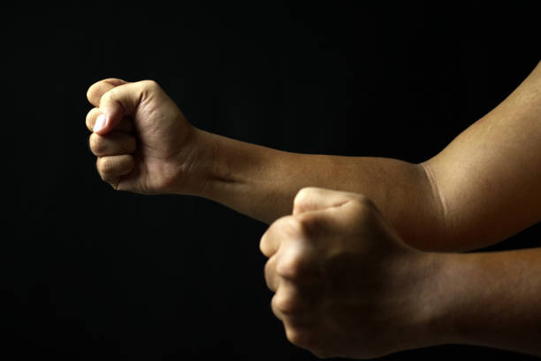 istock male hand fist on black background 2178716284