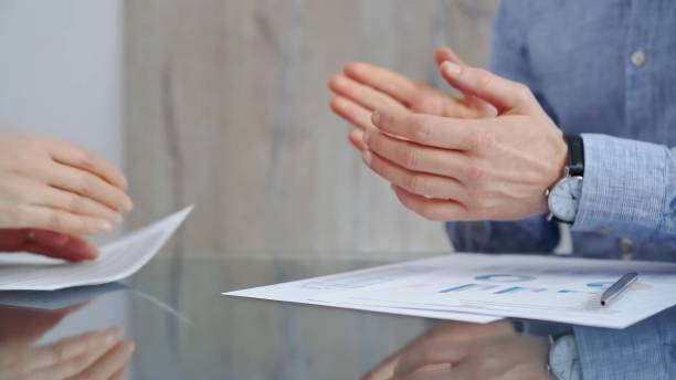 istock Unrecognizable business people clapping over glass table after contract signing in office. Agreement and handshake themes 2178717248