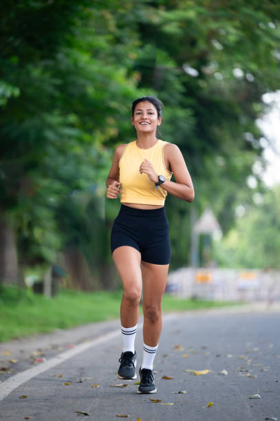istock Young Woman Jogging Outdoors on a Forest Path 2178720019