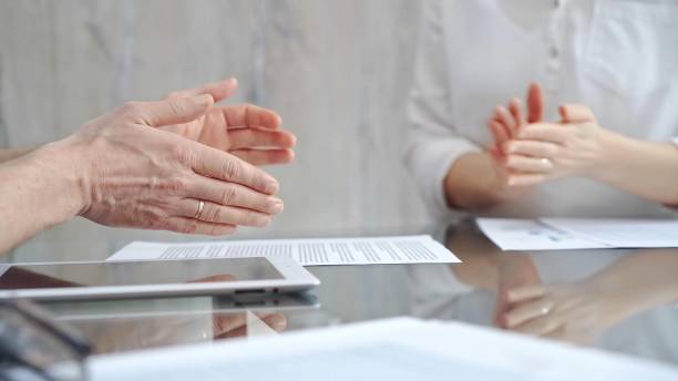 istock Unrecognizable business people clapping over glass table after contract signing in office. Agreement and handshake themes 2178721677