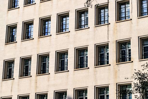 istock Symmetrical Windows on a Modern Beige Building Facade 2178723810