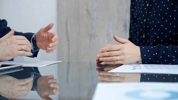 istock Professional handshake between two professionals and applauds at a corporate meeting with reflection on table over a business meeting. Business people concept 2178725198