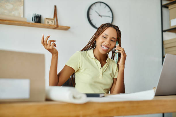 istock Young woman engaged in conversation at a busy post office during her workday 2178725243