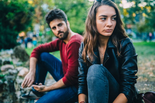 istock Young couple with problems in the city park 2178726542