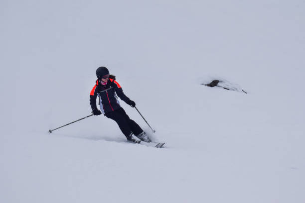 istock Female skier descending in low visibility 2178727996