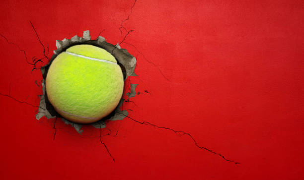 istock Tennis ball cement wall concept of strength. 2178731201