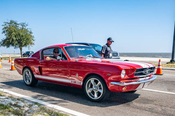 Gulfport, MS - October 03, 2023: High perspective front corner view of a Customized 1965 Ford Shelby Mustang GT 350 Fastback Coupe at a local car show.