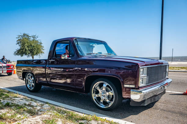 Gulfport, MS - October 03, 2023: High perspective front corner view of a Customized 1985 Chevrolet C10 Pickup Truck at a local car show.