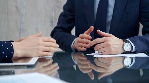istock Unrecognizable business people shaking hands and clapping over glass table after contract signing in office. Agreement and handshake themes 2178731619