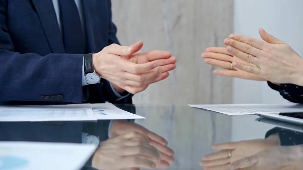 istock Unrecognizable business people shaking hands and clapping over g 2178732631